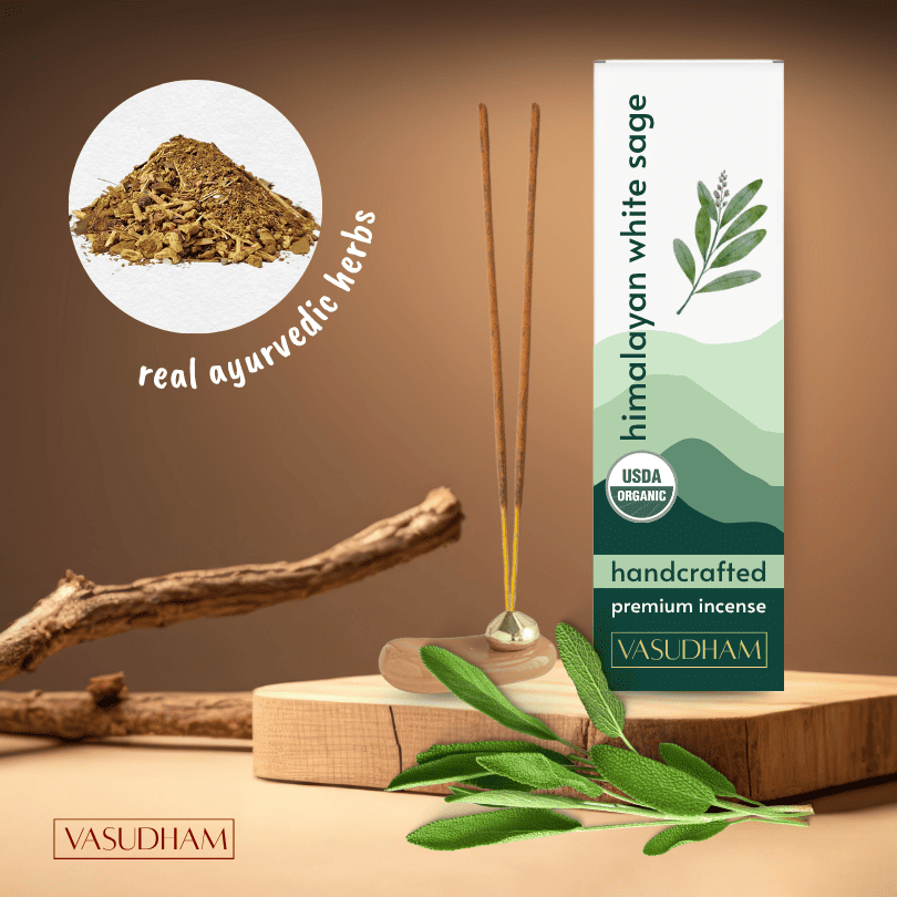 Himalayan white sage incense with packaging and herbs on a wooden surface
