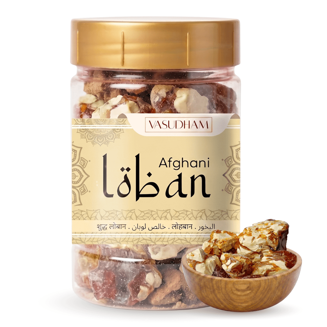 A clear plastic jar of Vasudhami Afghani loban with a gold lid and beige label, shown alongside a small wooden bowl of the mixed nuts on a white background.