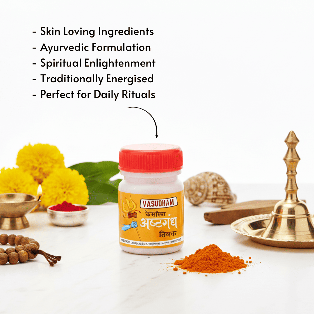 A small white plastic bottle of Vasudham Ayurvedic formulation with a red cap and yellow label, centered on a white surface with decorative herbs, brass utensils, and orange powder. Black text at the top lists product benefits.