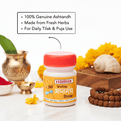 A bottle of Vasudham Ashtgandh Tilak paste centered on a white surface, surrounded by decorative props including a brass pot, yellow flowers, a seashell, a beaded bracelet, and a text callout emphasizing genuine ashtandh and daily tilak use.