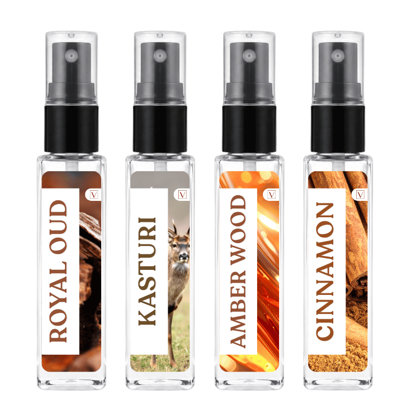 Four clear glass perfume spray bottles with black pump caps, shown side by side on a white background. The labels read ROYAL OUD, KASTURI, AMBER WOOD, and CINNAMON, with warm amber and brown scent imagery on the bottles.