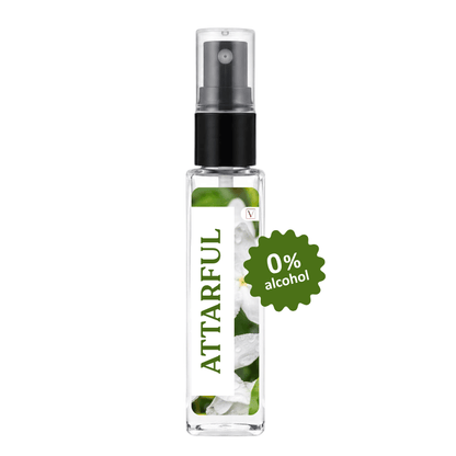 A clear glass perfume or body spray bottle with a black pump and a white label featuring green leaves and white flowers. The label reads 'ATTARFUL' vertically, and a green starburst badge says '0% alcohol'.