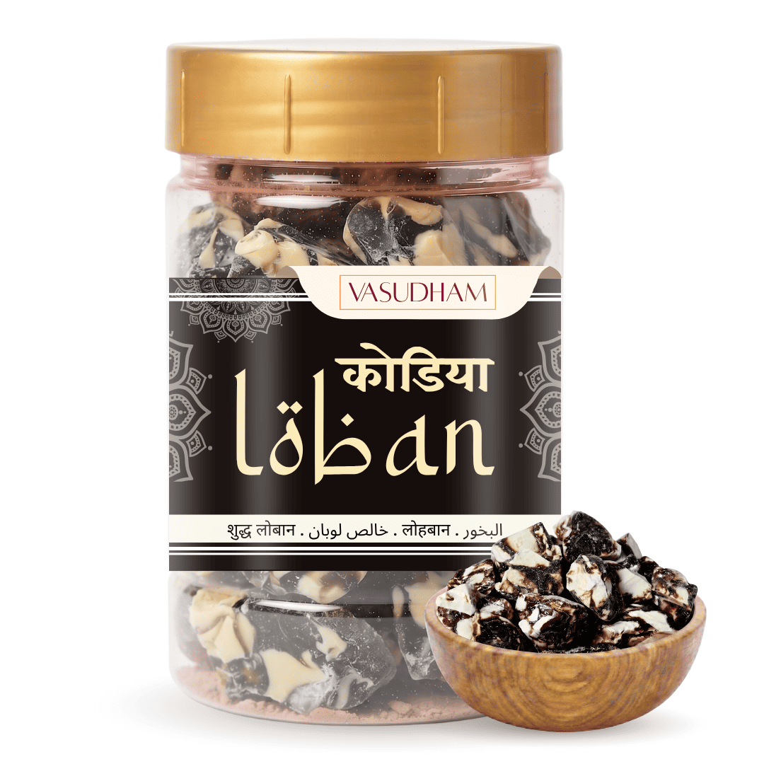 A jar of Vasudham black kodia loban with a gold lid and black label, shown alongside a small wooden bowl of the loban pieces on a white background.