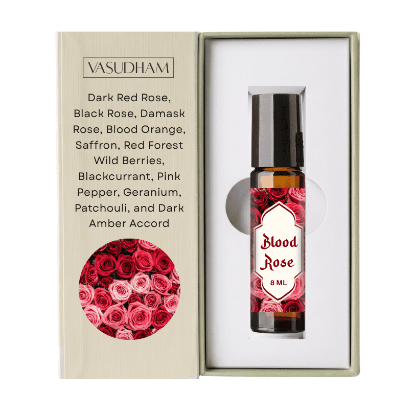 Vasudham Blood Rose 8ml rollerball perfume oil presented in its original packaging, featuring a beige textured box with rose illustrations and a clear bottle with a red rose patterned label.