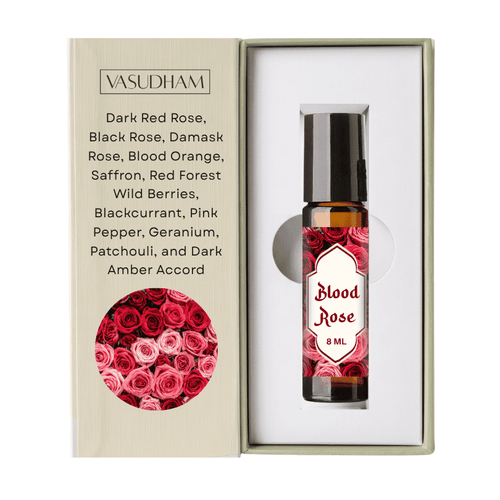 Vasudham Blood Rose 8ml rollerball perfume oil presented in its original packaging, featuring a beige textured box with rose illustrations and a clear bottle with a red rose patterned label.