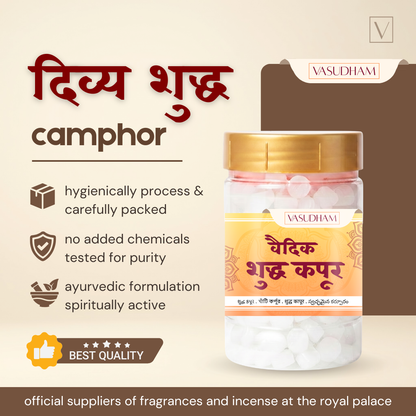 A jar of Vasudham Ayurvedic Camphor tablets on a beige promotional background with Hindi text, icons, and quality claims.
