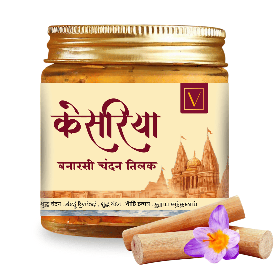 Jar of Vasudham chandan tilak with sandalwood sticks and saffron on a white background