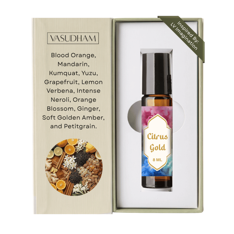 Vasudham Citrus Gold 8ml rollerball perfume oil shown in its open presentation box. The left panel lists ingredients including blood orange, mandarin, and ginger, while the right side displays the amber glass bottle with a black cap and a pink and blue gradient label.