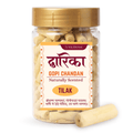 Pet jar with yellow cap and vasudham gopi chandan pieces inside and dwarika chandan written on label