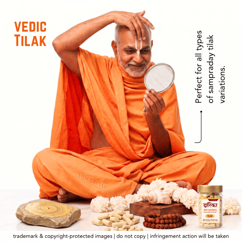 A man in orange robes sits cross-legged on a white background, holding a small mirror and applying a white powder to his forehead in a ritual gesture. Orange text reads 'VEDIC TILAK' on the left, with additional promotional text on the right and product items arranged at the bottom, including a jar labeled 'VEDIC TILAK'.