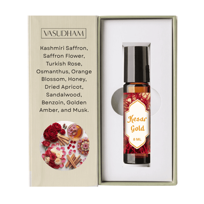 Vasudham Kesar Gold 8ml rollerball oil in its original packaging, featuring a beige textured box with rose and saffron illustrations next to the white inner box containing the amber glass bottle.