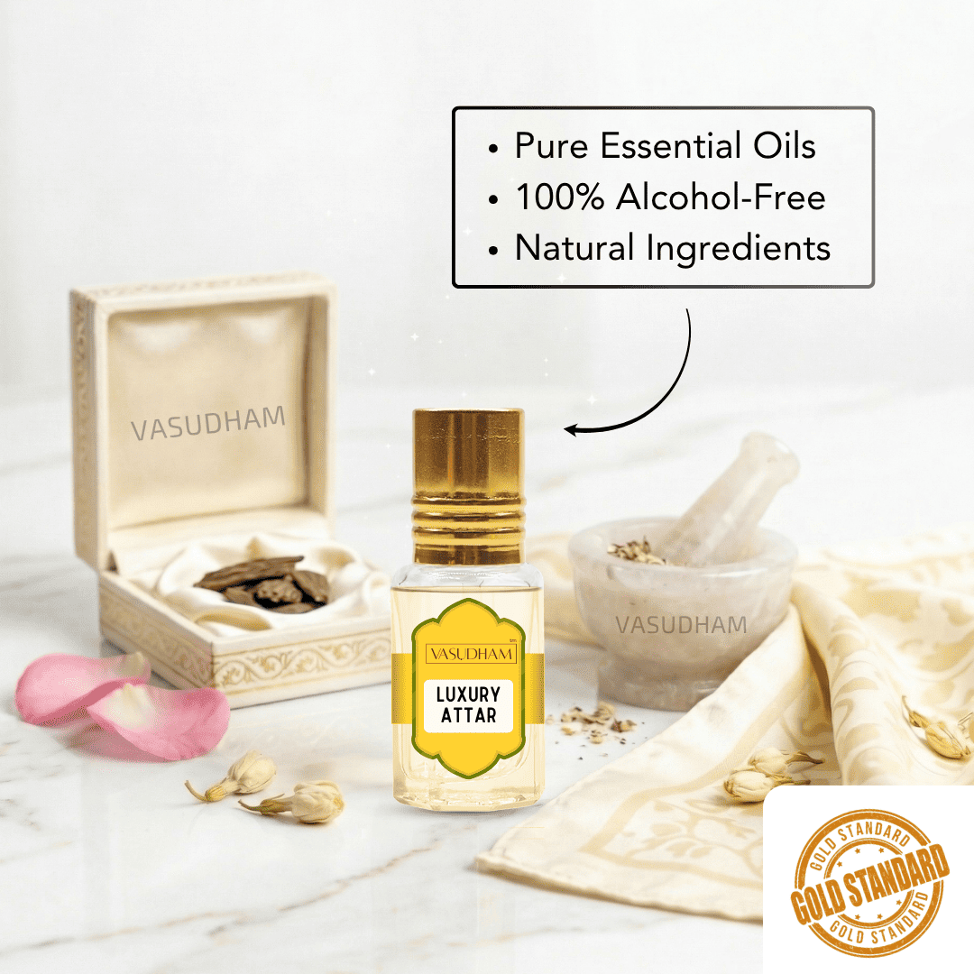 A bottle of Vasudham Luxury Attar essential oil is displayed on a marble surface with its open presentation box, a mortar and pestle, and pink flower petals. A text bubble highlights key product features, and a 'Gold Standard' badge is in the bottom right corner.