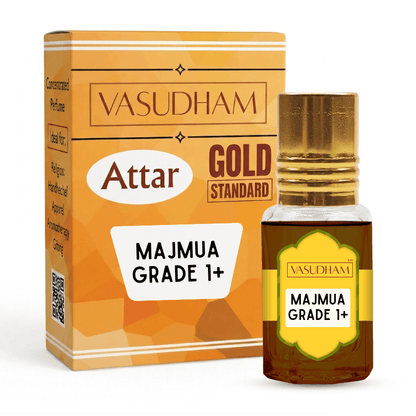 Vasudham Attar Gold Standard Majmuja Grade 1+ perfume oil bottle with a gold cap next to its orange and gold packaging box on a white background.