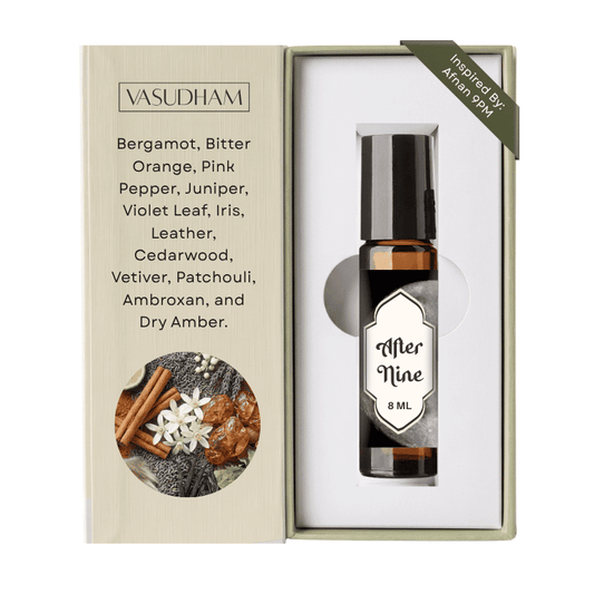 Vasudham Merine 8ml essential oil bottle presented in its open packaging box, featuring a beige exterior with scent notes and a circular botanical illustration, and a white interior holding the bottle.