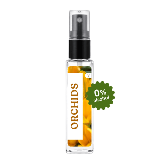 A clear glass perfume or fragrance spray bottle labeled 'ORCHIDS' with a black pump, shown on a white background with a green '0% alcohol' badge.