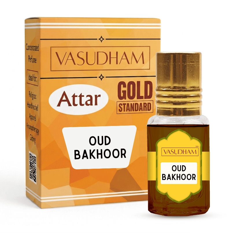 Vasudham Attar Gold Standard Oud Bakhoor perfume oil shown with its orange and gold retail box and a small glass bottle with a gold cap on a white background.