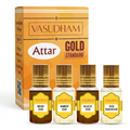 Vasudham Attar Gold Standard perfume oil set, featuring a golden-orange box and four small glass bottles with gold caps labeled Musk Oud, Amber Oud, Black Oud, and Oud Bakhoor.