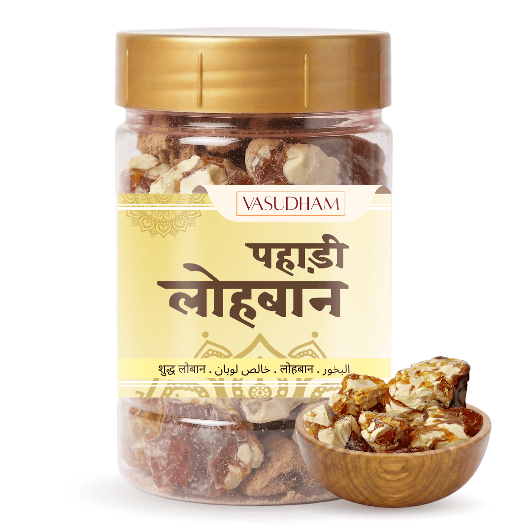 A jar of Vasudham Pahadi Loban (frankincense) with a gold lid and cream-colored label, shown alongside a small wooden bowl of chopped frankincense on a white background.