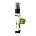 A clear glass perfume spray bottle with a black pump, featuring a white label with green text reading 'PARIJAT' and a floral print. A green starburst badge on the right says '0% alcohol'.