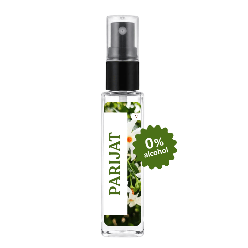 A clear glass perfume spray bottle with a black pump, featuring a white label with green text reading 'PARIJAT' and a floral print. A green starburst badge on the right says '0% alcohol'.
