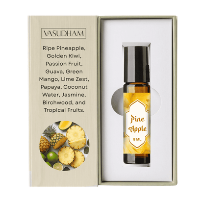 A 8 ml bottle of Vasudham Pine Apple essential oil displayed inside its open presentation box next to its printed packaging insert.