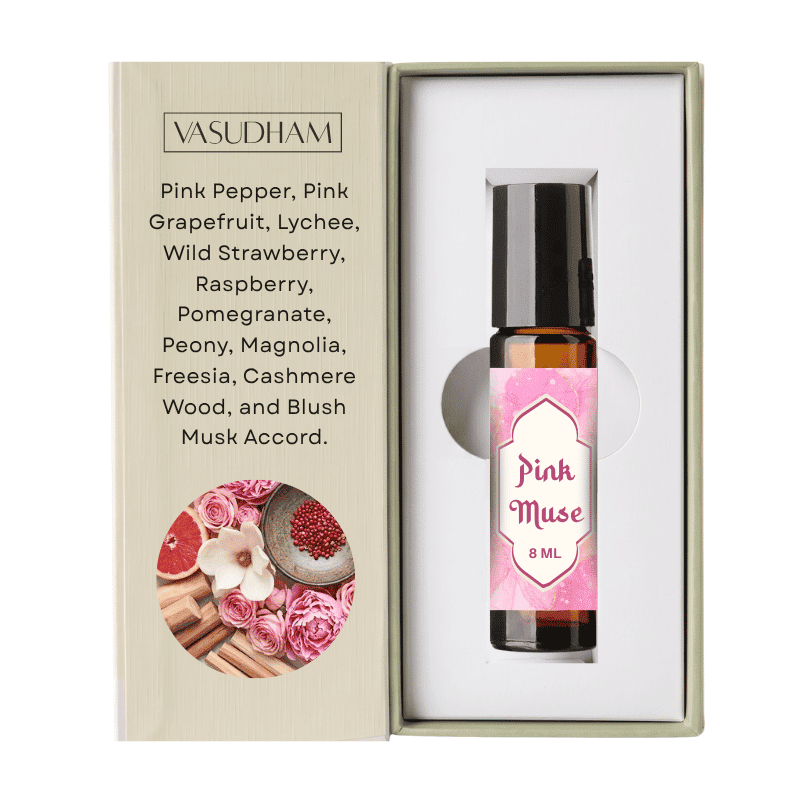 Vasudham Pink Muse essential oil roller bottle in its presentation box, featuring a pink label and a list of scents on the left side.