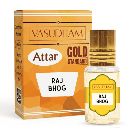 Vasudham Attar Gold Standard Raj Bhog perfume oil bottle with a gold cap next to its orange and gold packaging box on a white background.