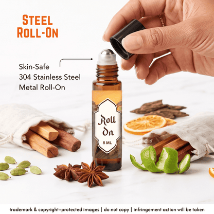 An 8 ml steel roll-on bottle with an amber glass body and a silver stainless steel roller top, shown with a hand lifting the cap. The bottle is surrounded by natural ingredients including cinnamon sticks, star anise, green pistachios, and lime peels in a white fabric pouch, set against a clean white background with promotional text overlays.