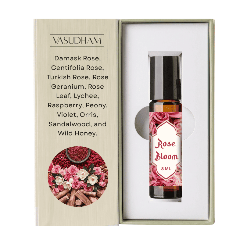 Vasudham Rose Bloom essential oil roller bottle in its open presentation box, featuring a beige exterior with a rose and spice illustration and a white interior.