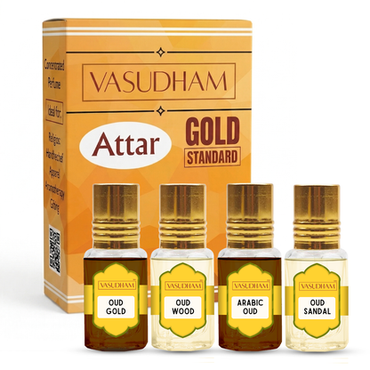 Vasudham Attar Gold Standard perfume set, featuring a golden-orange retail box and four small glass bottles with gold caps labeled Oud Gold, Oud Wood, Arabic Oud, and Oud Sandal.