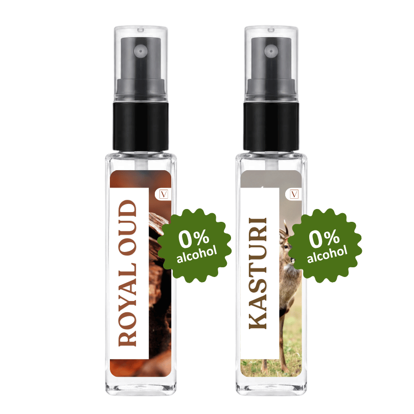 Two clear spray bottles with black pump tops on a white background, labeled ROYAL OUD and KASTURI, each with a green 0% alcohol badge overlay.