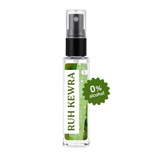 A clear glass spray bottle with a black pump and a green-and-white label reading 'RUH KEWRA' and '0% alcohol', shown on a plain white background.