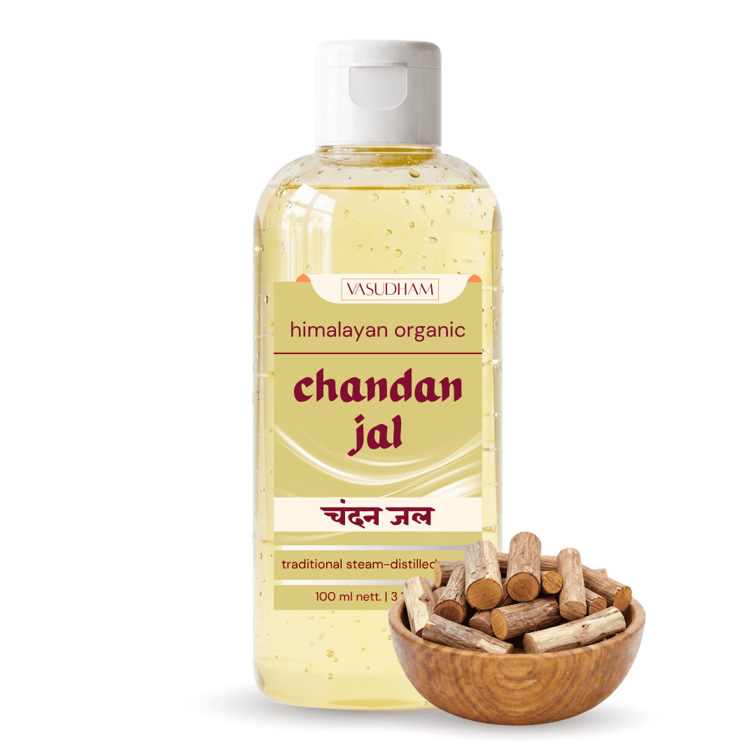 A bottle of Vasudhmi Himalayan Organic Chandan Jal traditional steam-distilled resin, shown next to a small wooden bowl filled with chunks of the resin, on a clean white background.