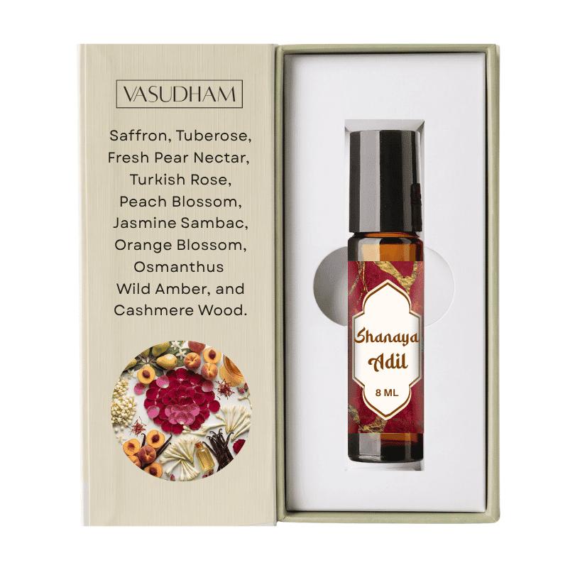 Vasudham Shanaya Adil 8ml essential oil roller bottle presented inside its white gift box next to its beige packaging insert.