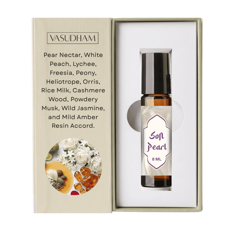 Vasudham Soft Pearl 8ml essential oil roller bottle presented inside its beige gift box, alongside a printed description of the scent notes.