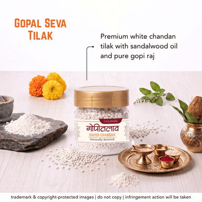 A jar of Safed Chandan (natural wood toe nail paste) displayed on a light wood surface with traditional Indian styling props including marigolds, brass bowls, and a coconut. Text overlays describe the product as 'Gopal Seva Tilak' and 'Premium white chandan'.