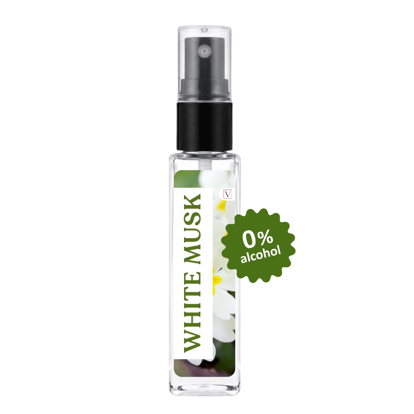 A clear glass perfume spray bottle labeled 'WHITE MUSK' with a black pump, shown on a white background with a green '0% alcohol' badge.