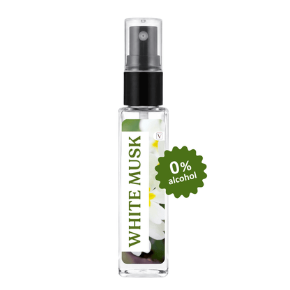 A clear glass perfume spray bottle labeled 'WHITE MUSK' with a black pump, shown on a white background with a green '0% alcohol' badge.
