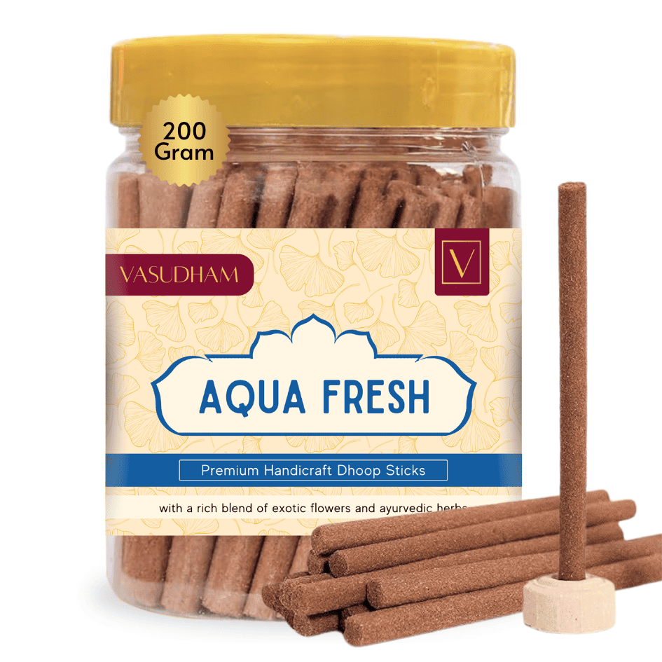 Jar of Vasudham Aqua Fresh dhoop sticks with a yellow lid on a white background
