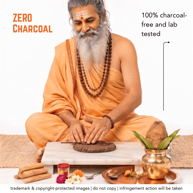 A seated man in an orange robe preparing a dark brown powder on a white marble slab, with decorative props including a brass pot, flowers, and stacked sticks. Text reads 'ZERO CHARCOAL' and '100% charcoal-free and lab tested'.